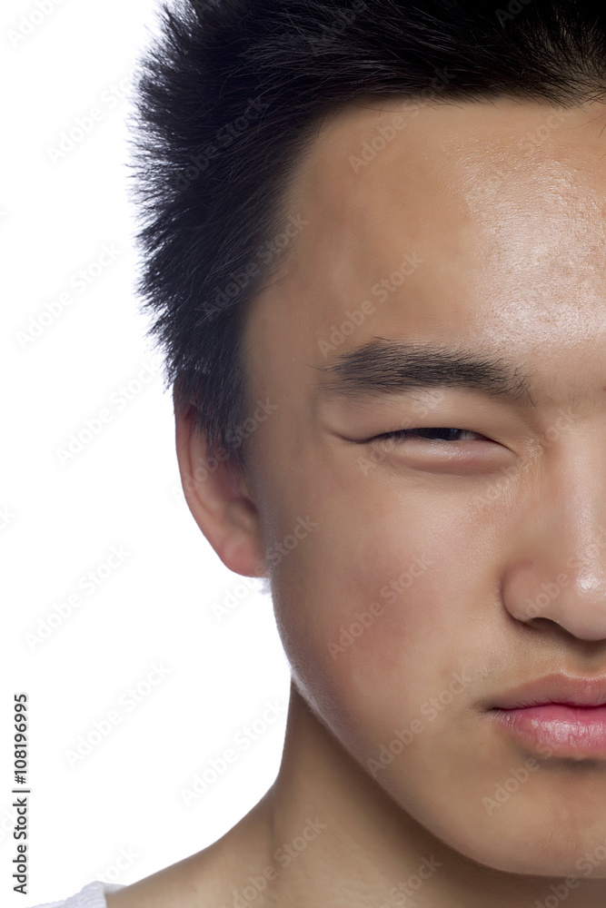 half face of an asian man half face of an asian man