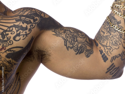 cropped image of a man with tattoo on his biceps. photo