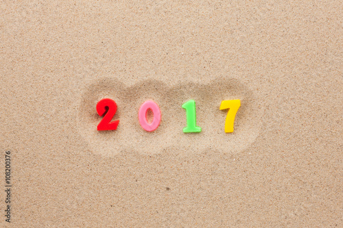 New year 2017 written in the sand