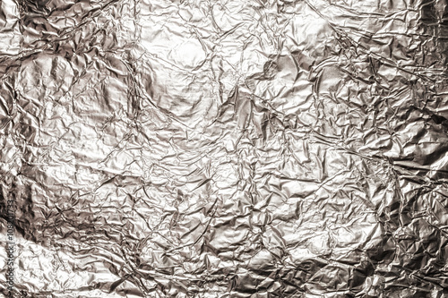 The texture of shiny aluminum foil close up