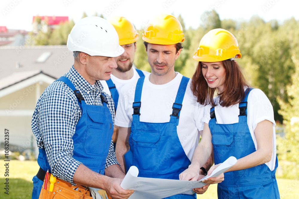 Team of buildres with plan Team of buildres with plan