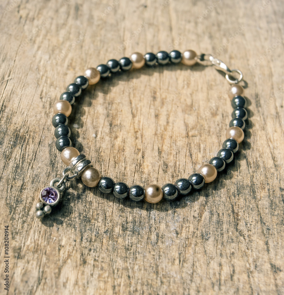 mineral stone yoga bracelet on wooden table mineral stone yoga bracelet on wooden table