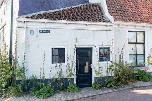Small old house in historic old town of Harlingen, Friesland, Netherlands photo