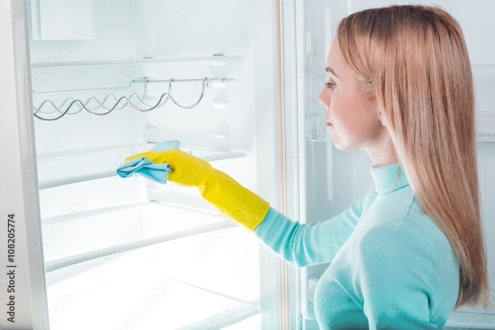 Young blonde at home near fridge Young blonde at home near fridge