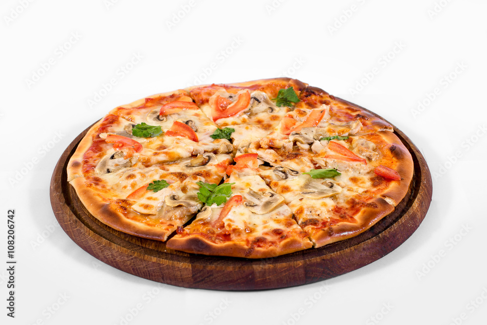 Pizza on a wood plate on a white background