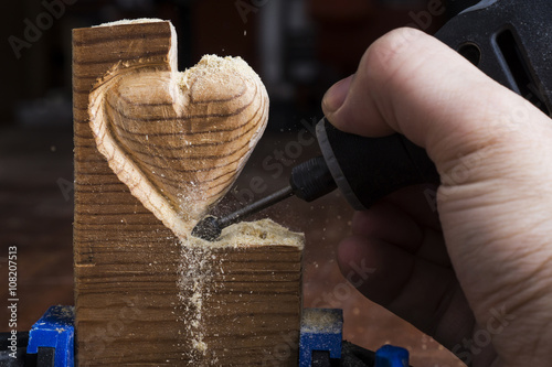 Carving wood in heart shape with rotary tool