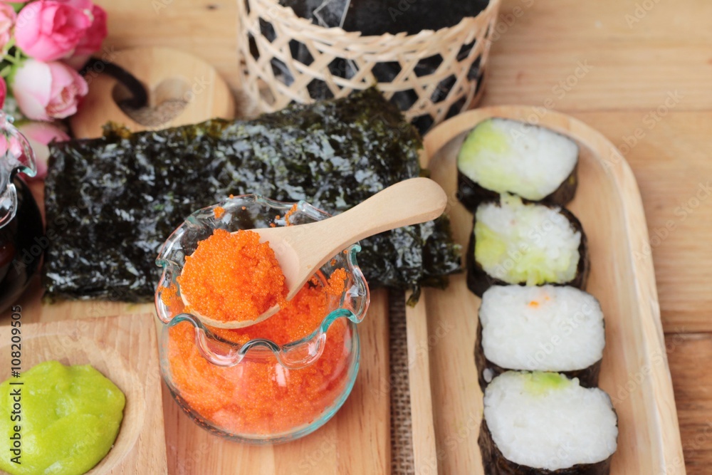 Making sushi roll with shrimp eggs delicious. Making sushi roll with shrimp eggs delicious.