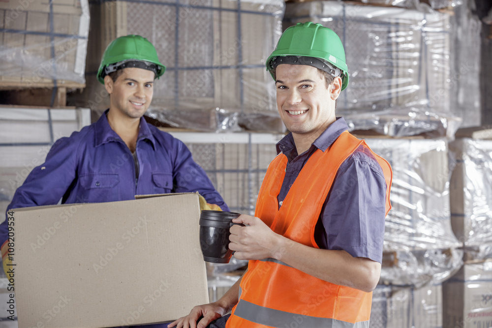 Workers In Warehouse Preparing Goods For shipping Workers In Warehouse Preparing Goods For shipping