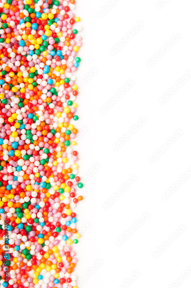 Fototapeta premium Sugar sprinkle dots, decoration for cake and bekery, a lot of sprinkles as a background