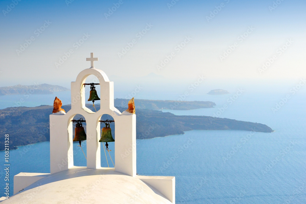 Unique bell tower on Santorini Island, Greece. The view toward Caldera sea waiting for sunset. - obrazy, fototapety, plakaty 