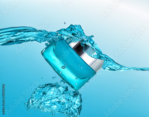 The blue jar of moisturizing cream in the blue water wave  with big air bubbles on the blue water background