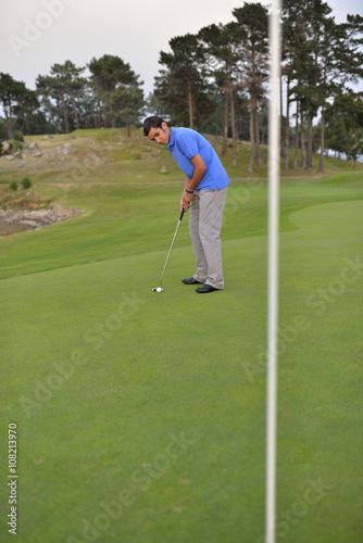 Young man playing golf