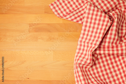 Tablecloth on wooden kitchen table with copy space. View from above