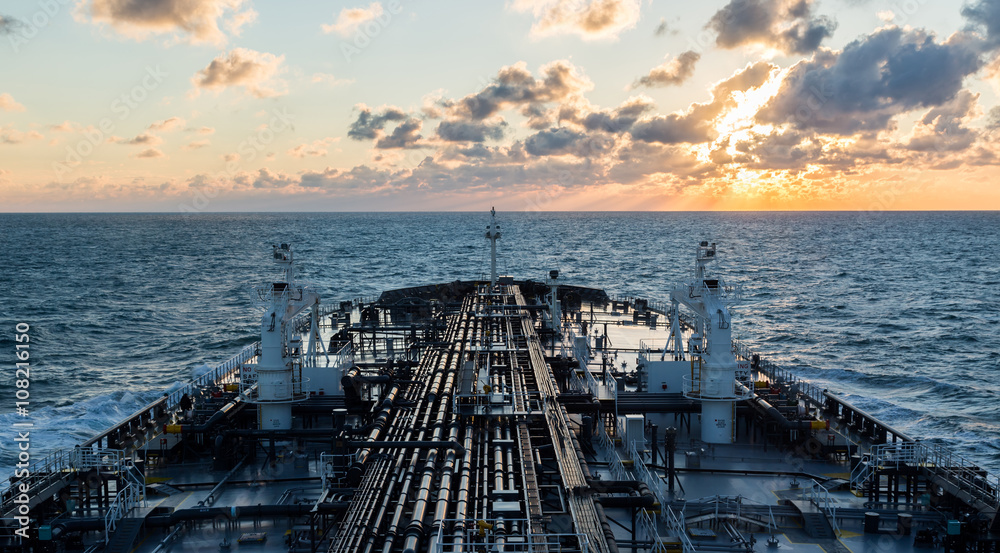 Obraz premium Sunset seascape with tanker deck