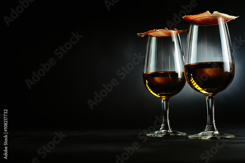 Elegant Spanish tapas on sherry glasses photo