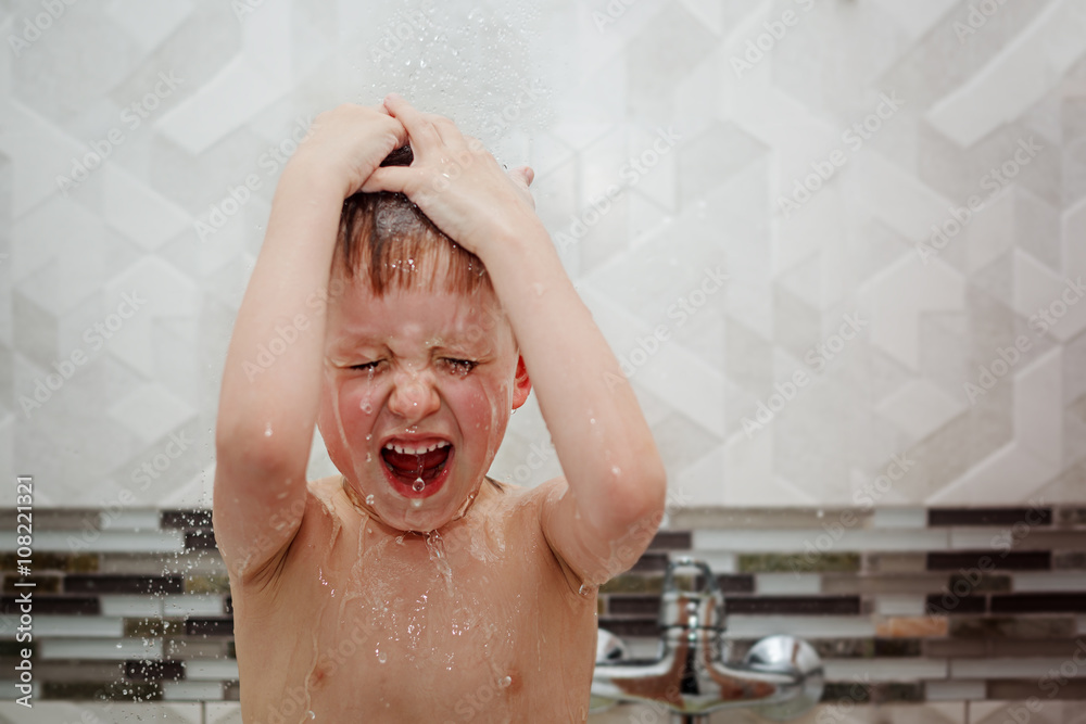 Cute little boy child taking in the bath. The symbol of purity a