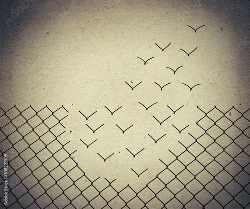 magical escape. Metallic wire mesh transform into flying birds. Old paper, vintage background