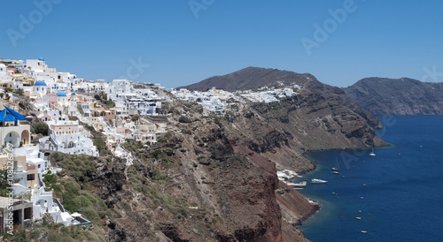 Santorini, one of the Cyclades islands in the Aegean Sea. The white houses of its 2 principal towns, Fira and Oia, cling to cliffs above an underwater caldera. They overlook the clear Aegean sea ...