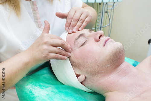 man in the mask cosmetic procedure in spa salon