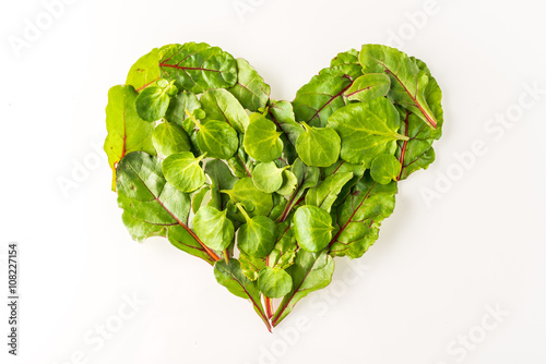 Heart shape made out of salad leaves