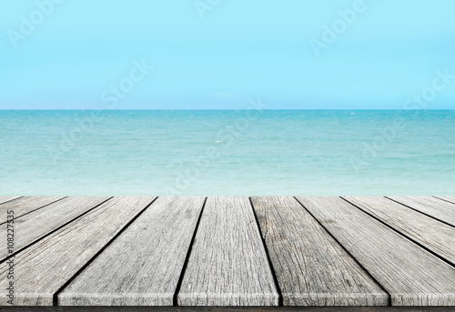 old wood table top on blurred beach background   summer concept