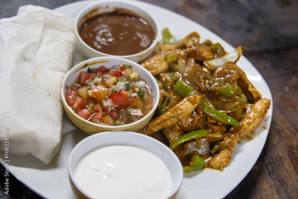 mexican dish with salad and frijoles bowl mexican dish with salad and frijoles bowl