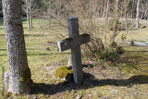 Old cross on the 19th - 20th century cemetery. 