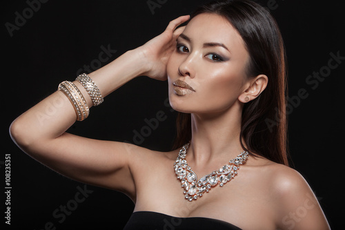 Young, beautiful and rich woman in jewels