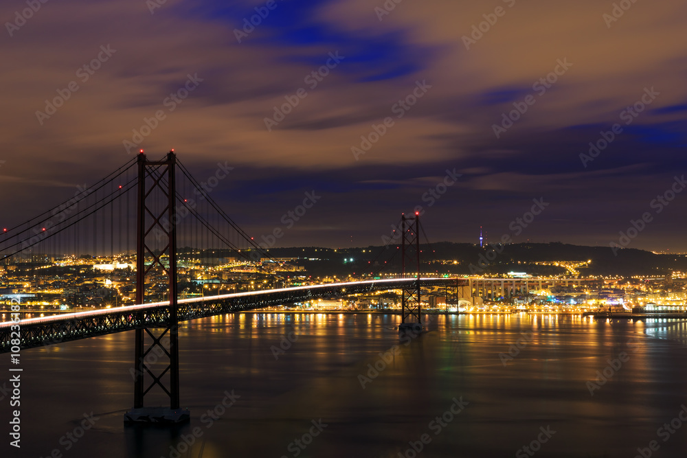 Fototapeta premium Night view of Lisbon and 25th of April Bridge, Portugal