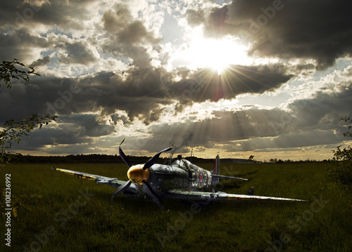 Photo Crashed Spitfire in field with dramatic sunset WWII