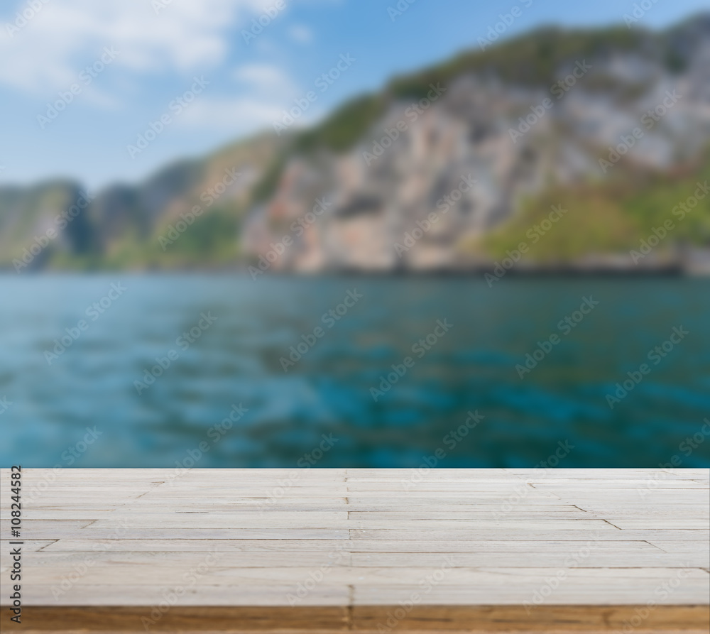 Wood table top or flooring on the beach background Wood table top or flooring on the beach background