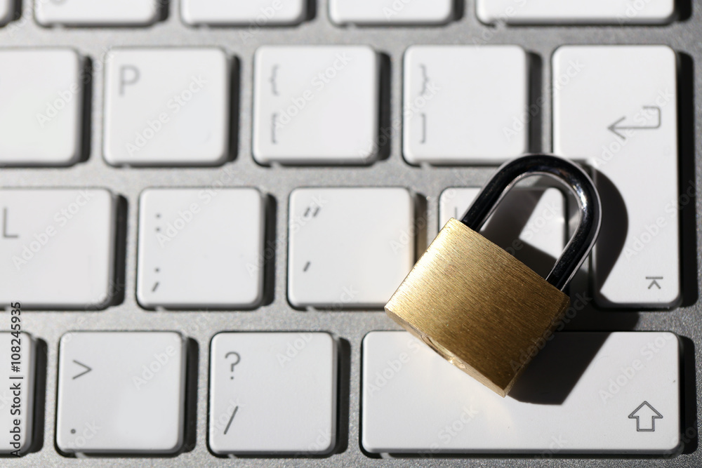 Cyber safety concept - lock on computer keyboard Cyber safety concept - lock on computer keyboard