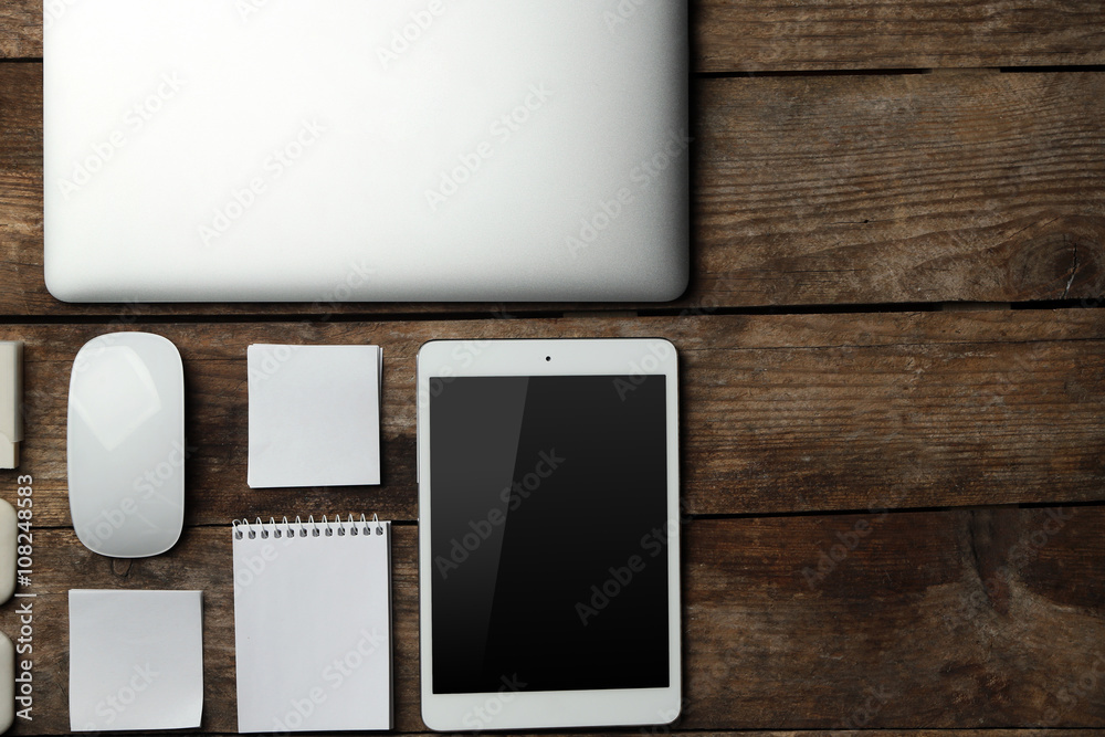 Set of office stationery with a computer on a wooden background Set of office stationery with a computer on a wooden background
