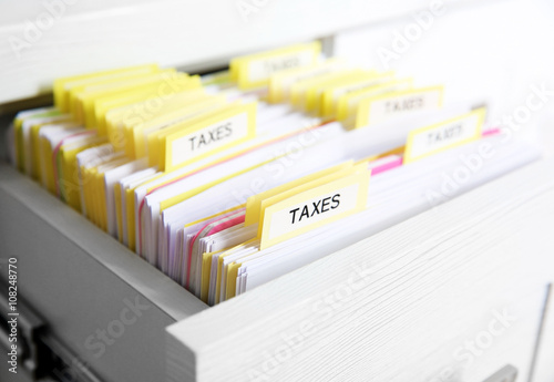 Open drawer with variety of tax documents
