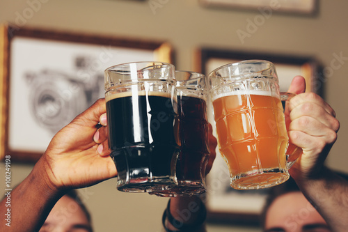 Group of happy friends drin...