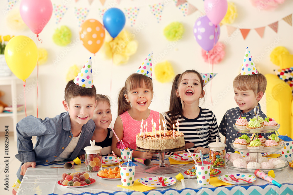 Happy group of children having fun at birthday party Happy group of children having fun at birthday party