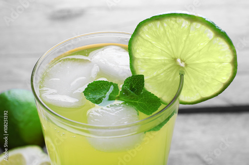 Glasses of lemon soda with ice and fresh mint, close up