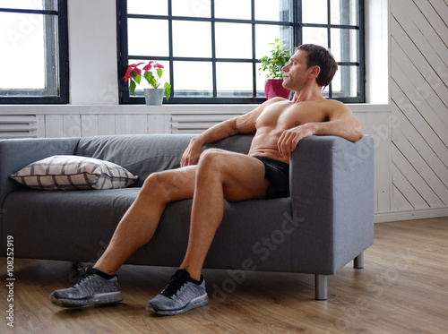A man relaxing on a chair.