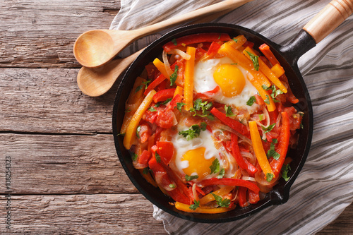 traditional Basque piperade with eggs close-up. horizontal top view
 photo