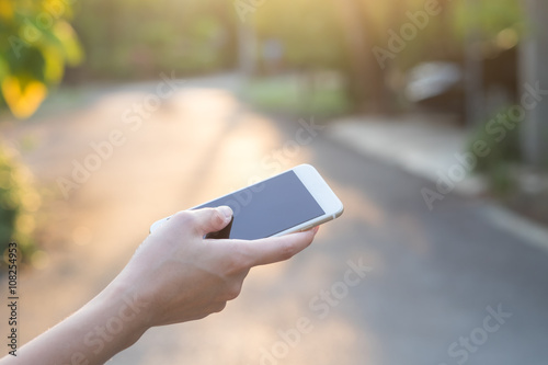 Close-up hand of asian woman using smart phone