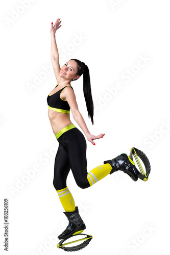 athletic brunette girl  jumping in a kangoo jumps shoes.
