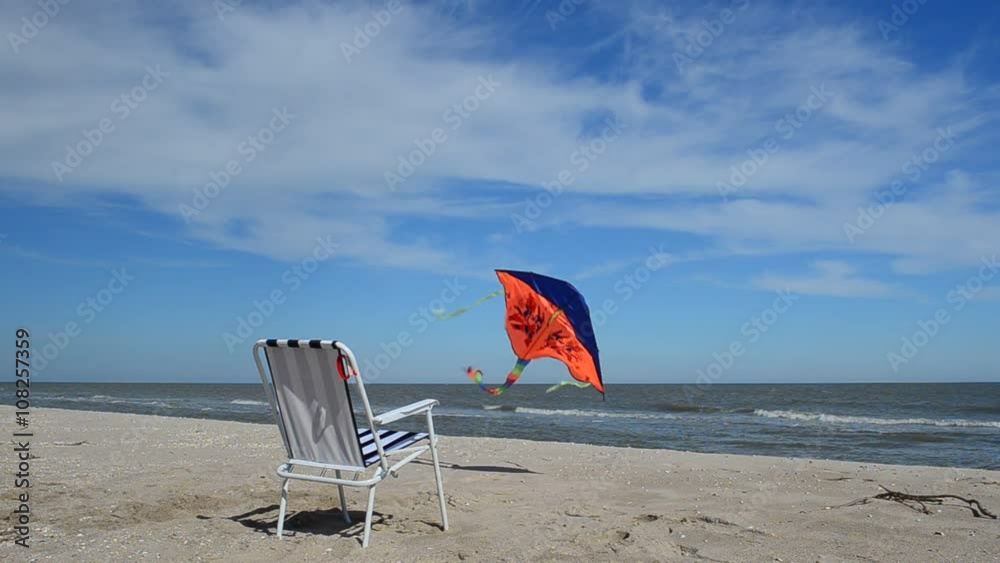 Chaise lounge on the beach, the sea and a kite. Chaise lounge on the beach, the sea and a kite.