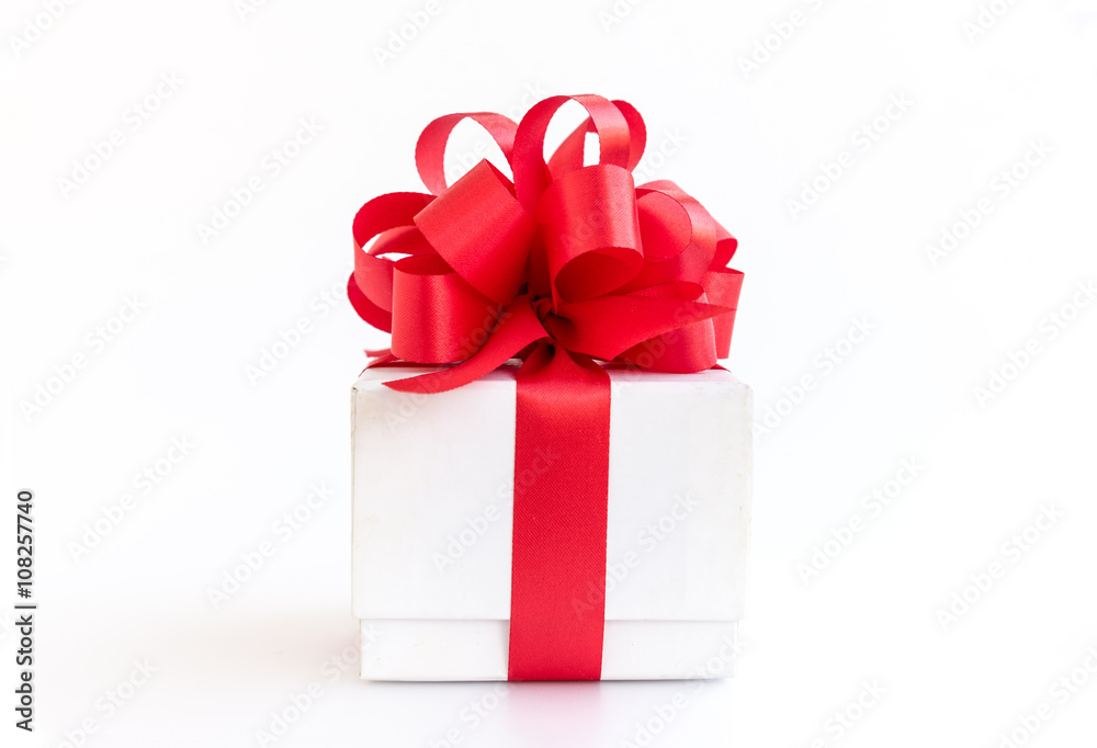 Obraz premium white gift box with red ribbon bow on white background