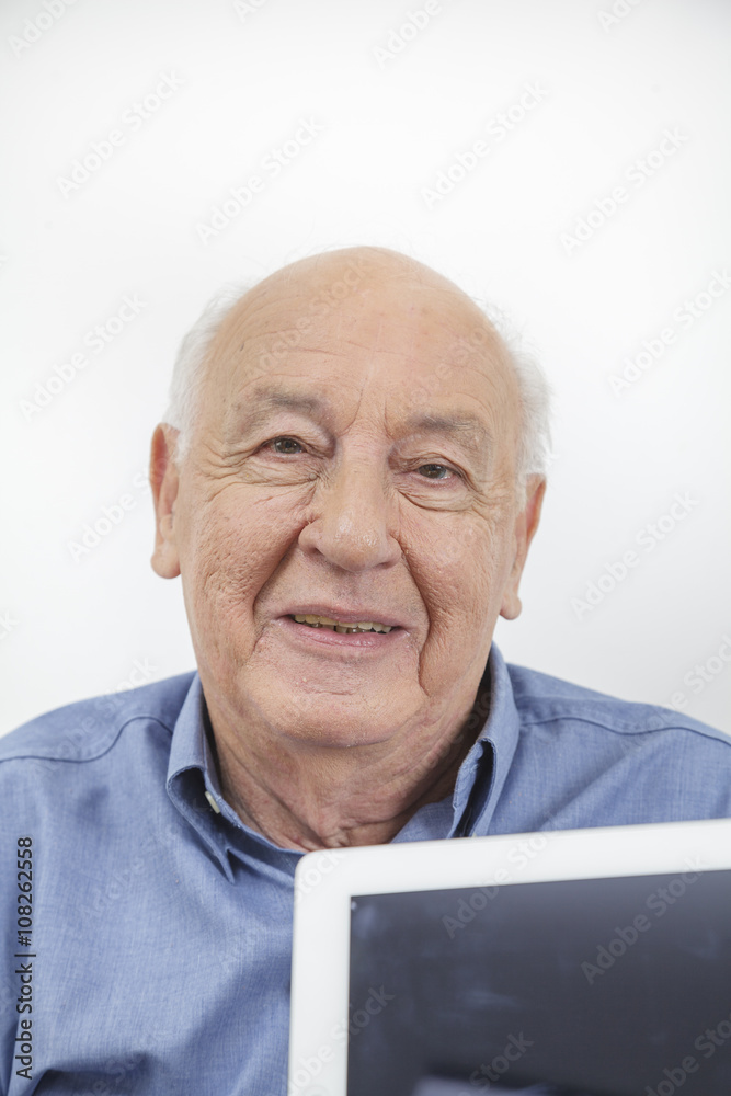 Old man using a Tablet Old man using a Tablet