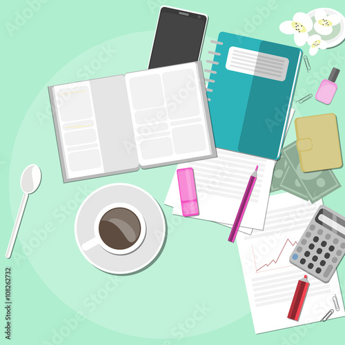 Working space with coffee, documents and flowers.