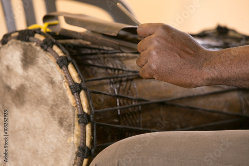 Hand of african man playing traditional instruments
