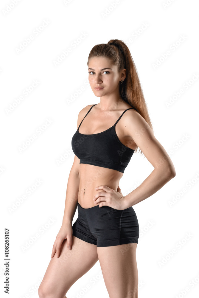 Cutout fitness woman in shorts and a tank top standing sideways Cutout fitness woman in shorts and a tank top standing sideways