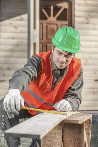 Contractor worker measuring job