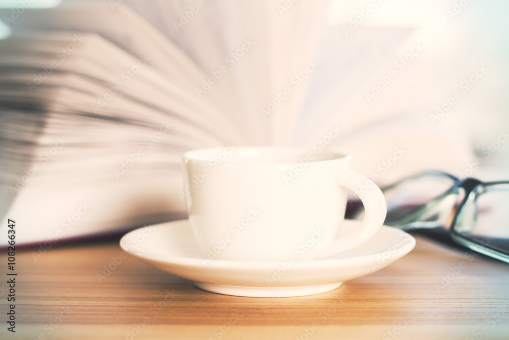 Coffee cup and book