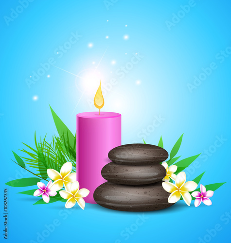 Spa stones and pink candles.